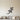 Black steel geometric lizard climbing diagonally