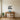 Geometric camel wall art above a sofa in a living room