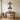 Geometric faceted cross metal art in a living room