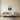 Geometric headphones wall art hanging above a bed in a bedroom