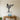 Low-poly martial artist in a belted uniform throwing a high kick