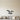 Black steel geometric seagull over a wave