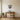 Geometric tulip bouquet wall art hanging above a sofa in a living room