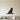 Black steel silhouette of a golden retriever sitting with a ball