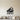 Black Grand Piano with Lid Raised Metal Wall Art on a light wall
