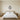 Hamsa hand wall art above a console in an entryway