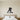 Black steel silhouette of a hockey player handling the puck on the ice