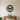 Black Interlocking Gears in a Ring Metal Wall Art on a light wall