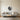 Bow hunting ring wall art hanging above a desk in a home office