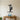 Black Lineman Climbing the Pole at Work Metal Wall Art on a light wall