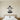 Geometric penguin with flippers out standing on an ice floe