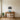 Pine forest metal wall art hanging above a sofa in a cabin living room