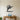 Black Sailfish Leaping over Waves Metal Wall Art on a light wall