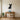 Sitting chihuahua metal wall art hanging on a living room wall
