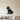 Black steel silhouette of a sitting pug with a collar