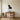 Sitting pug metal wall art in a living room