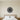 Black steel sun face with closed eyes and wavy rays