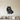 Black metal wall art of a sitting Pomeranian with a smiling face