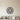 Black steel smiling sun face with wavy rays inside a round ring