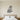 Black metal wall art of a snowy owl perched on a branch