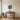 Beach house on stilts wall art hanging on a wall in a living room