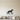 Metal wall art of a whippet in silhouette walking along a flat line