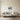 Round biplane metal art in a home office