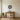 Vinyl record mandala wall art hanging above a record shelf in a living room