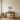 Walking Bear with Mountains metal wall art hanging in a living room above a sofa