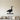Black steel silhouette of a wild goose standing in grass