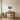 Wood duck metal wall art hanging above a sofa in a lodge-style living room